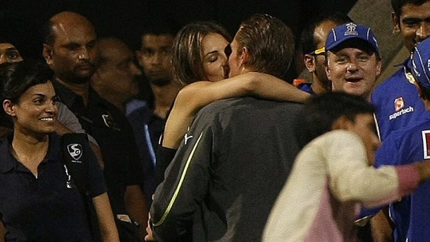 Shane Warne Liz Hurley share a kiss after an Indian Premier League match in May.