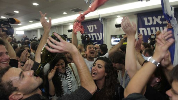 Triumph ... supporters of Yair Lapid and his Yesh Atid party celebrate the results.