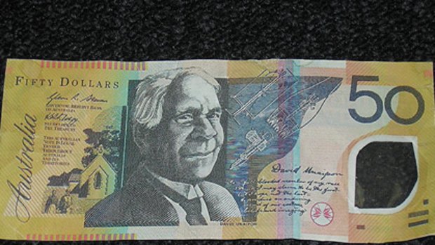 Make it fake ... a counterfeit $50 note seized by police. The shoddy security window gives it away.