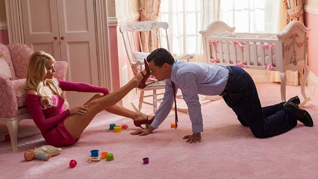 Deals and heels: Leonardo DiCaprio and Margot Robbie in <em>The Wolf of Wall Street</em>.
