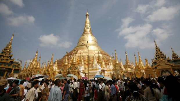 Devotees crowd the Shwedagon Pagoda during the Kason watering festival in Yangon.