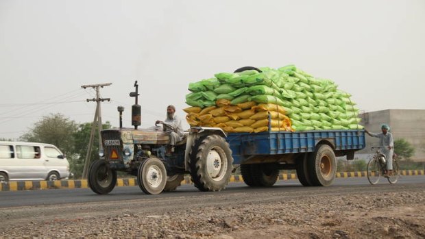 A truckload of fertiliser is driven north from Multan, Pakistan.