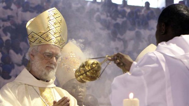 Keep the faith ... the Archbishop of Canterbury, Rowan Williams, conducts a church service in Harare.