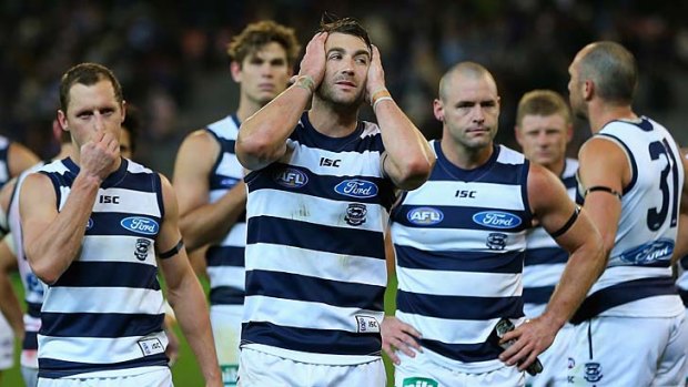 Devastation: Geelong players James Kelly, Corey Enright, Josh Hunt and James Podsiadly after the 16-point loss to Fremantle.
