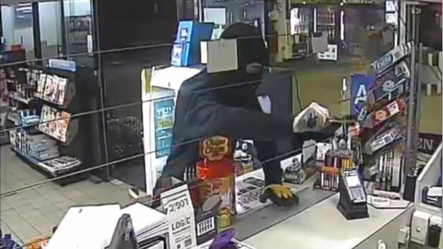 Police have released an image of one of the armed robberies.