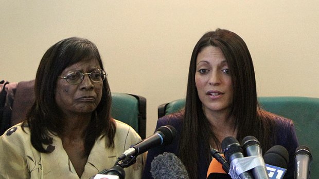 Suffering goes on ... Meredith Kercher's mother Arline, left, and sister Stephanie address a press conference before court proceedings begin.