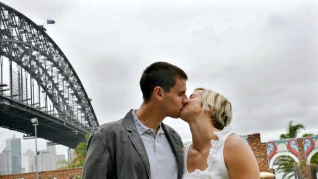 Lib smacker . . . Libby Trickett and husband Luke kiss after the Olympic champion announced her decision to retire from swimming yesterday.