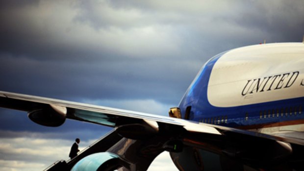 President Barack Obama boards Air Force One after speaking at the Massachusetts Institute of Technology, where he urged Americans to embrace alternative energy innovations.
