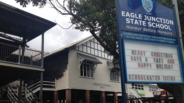 The charred school buildings this morning.