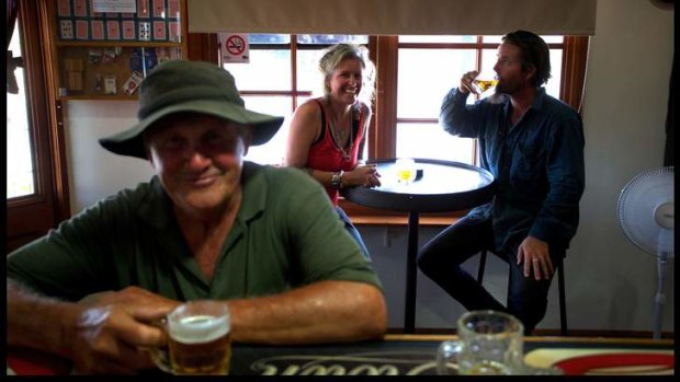 Peter Booth and (background) Ske Rhodes-Mitchell and Andrew 'Tommy' Taylor having a cold beer at the Thoona Pub after the power came back on.