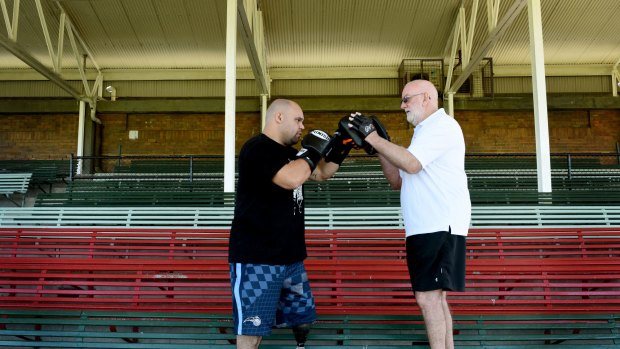 No giving up: Brad Hardman with boxing trainer Johnny Lewis.