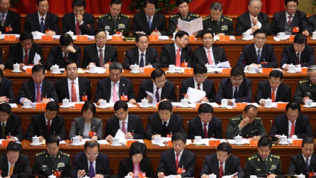 Delegates attend the opening of the 18th National Congress of the Communist Party of China at the Great Hall of the People in Beijing.
