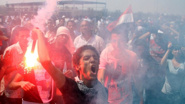Protesters outside the trial of ousted Egyptian president Hosni Mubarak.
