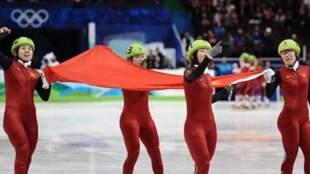(Top) Chinese gold medalists (left to right ) Meng Wang, Hui Zhang, Linlin Sun and Yang Zhou celebrate with their national flag after winning and (bottom) South Koreans Eun-byul Lee (left) and Seung-hi Park react after being disqualified.
