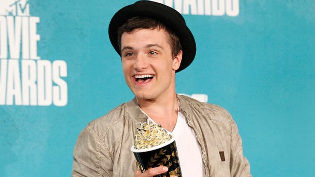 <i>Hunger Games</i> actor Josh Hutcherson shows his excitement while posing with his award for best male performance.