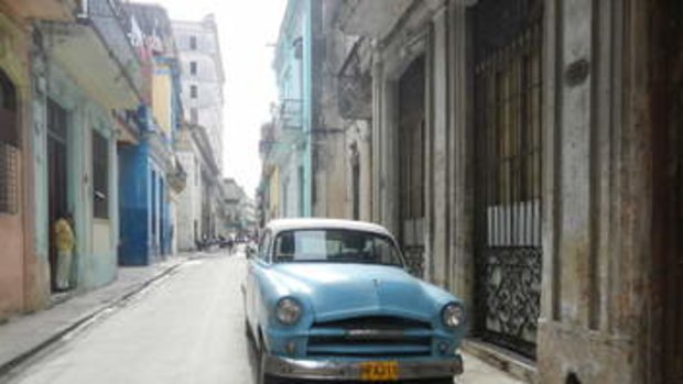 A street in Havan, with one of the city's iconic blue cars.