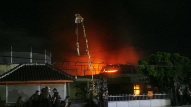 Damage ... Bali's Kerobokan jail is lit up by fire.