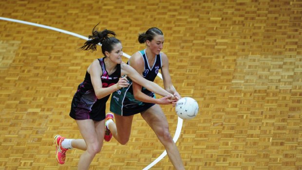 Simone Nalder from the Canberra Darters takes on Victoria Fury's Emily Mannix in last weekend's game.