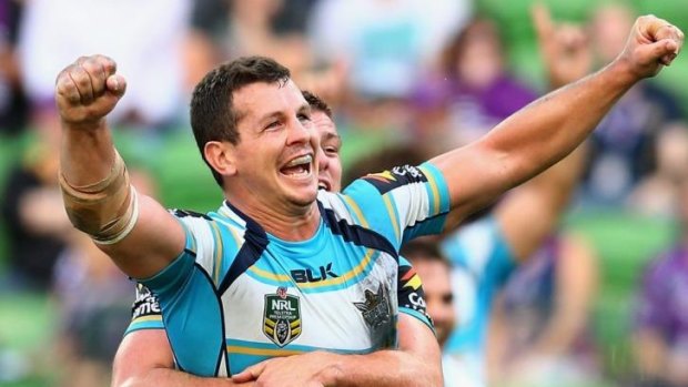 Flying high: Greg Bird celebrates kicking the winning penalty goal against Melbourne that took the Gold Coast Titans to the top of the NRL table.