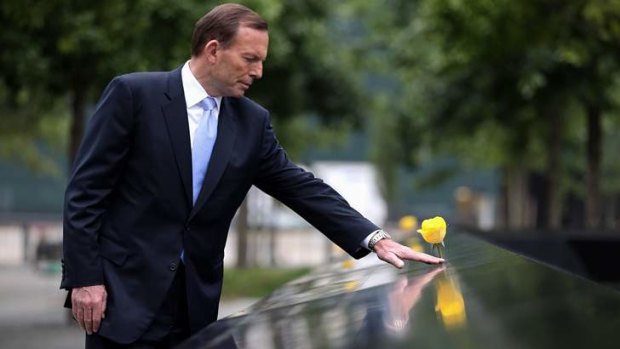 Prime Minister Tony Abbott visited the 9/11 Memorial in New York pausing at the names of Australian victims.