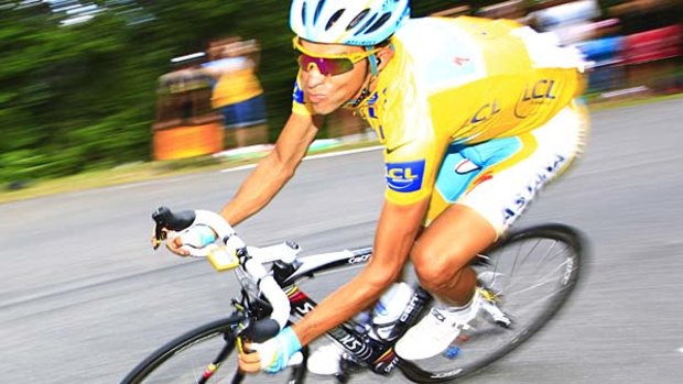 Race leader Alberto Contador speeds down the slopes of the Col d'Aspin pass.