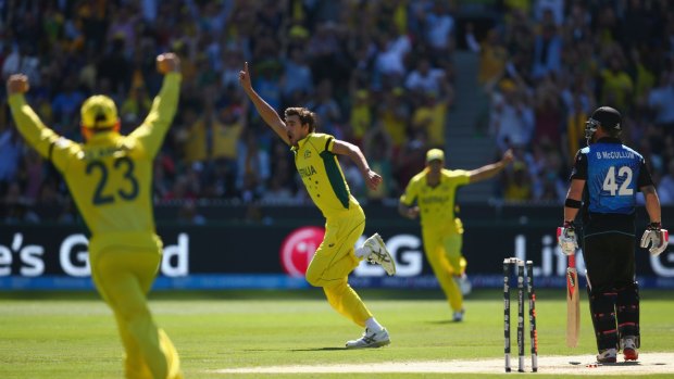 Clean bowled: Mitchell Starc celebrates taking the wicket of Brendon McCullum during the World Cup final.