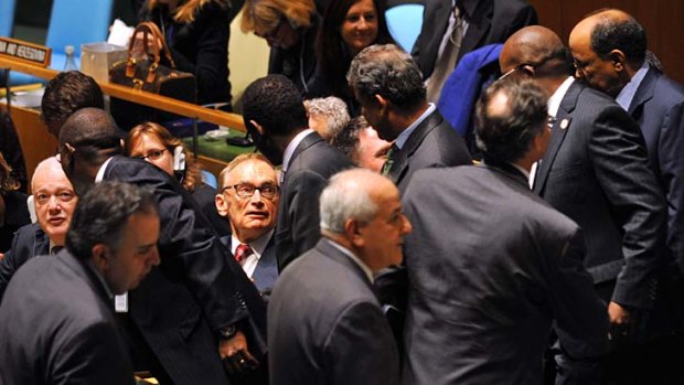 On top of the world ... Australia's Foreign Minister Bob Carr, centre, and Australia's Ambassador to the United Nations, Gary Quinlan , left, greet delegates.