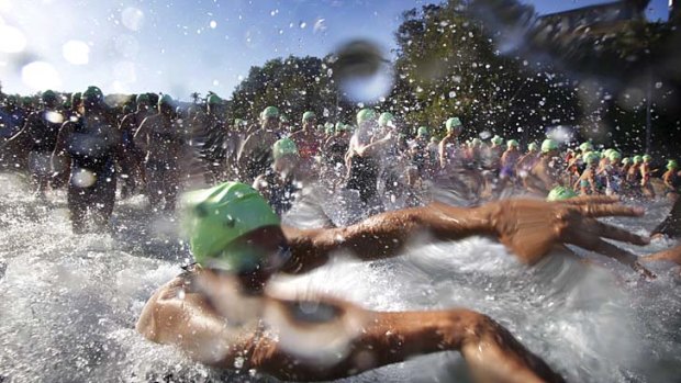 Wet and wild: Competitors make a splash in Sunday's swim.