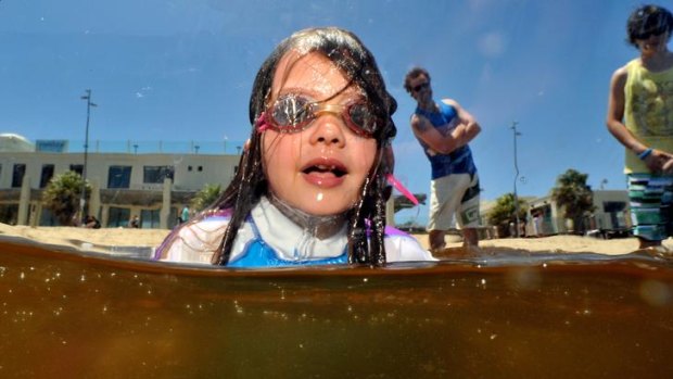 Mahlan Yates, 8, took her chances with a dip at St Kilda beach yesterday, despite the water’s murky appearance.