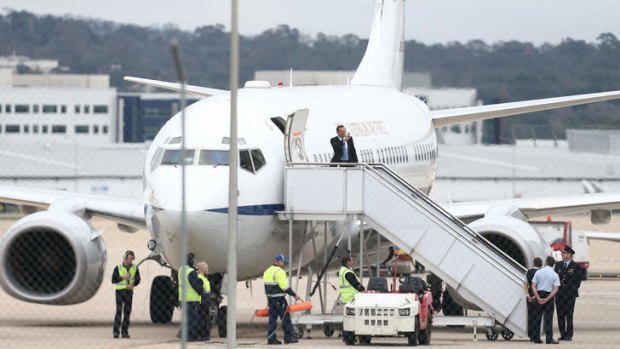 Prime Minister Tony Abbott boards his flight on the backup plane. Photo: Alex Ellinghausen