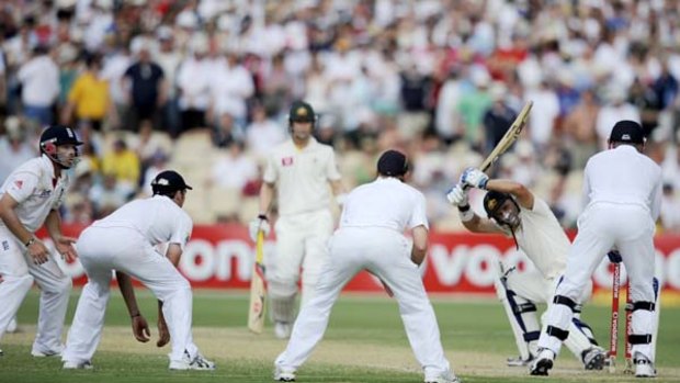 Testing times . . . Michael Hussey had to tread carefully yesterday as Andrew Strauss surrounded the Australian with close-in fieldsmen.