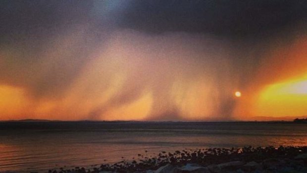 Bushfire burning on Stradbroke Island, as seen from across Moreton Bay.