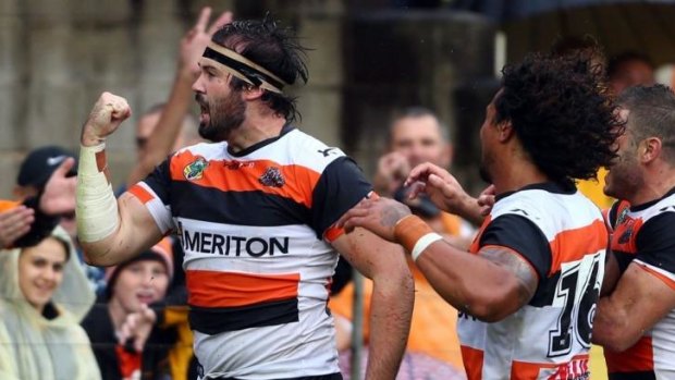 Wests Tigers prop Aaron Woods celebrates his try against Manly at Leichhardt Oval.