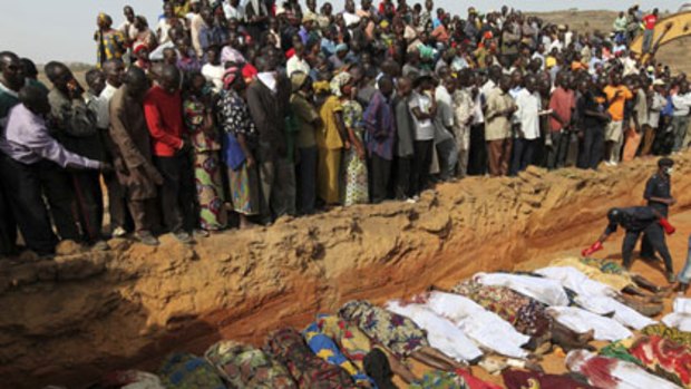 Range war ... villagers at Dogo Nahawa mourn at a mass grave for Berom Christians killed by  Fulani nomads, seeking revenge for the deaths of Muslim herders in January.