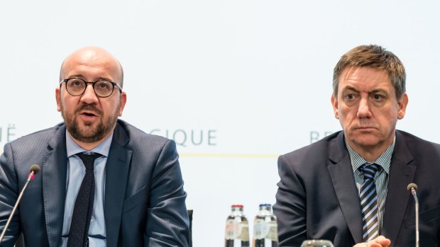 Belgian Prime Minister Charles Michel, left, and Belgium's Interior Minister Jan Jambon address the media in the wake of the attacks.