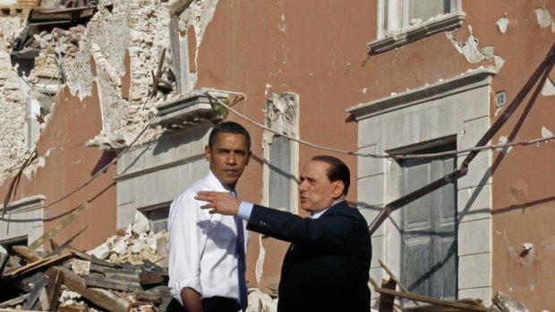 Devastation... US President Barack Obama tours the earthquake-hit Italian town of Onna with Italian Prime Minister Silvio Berlusconi in 2009.