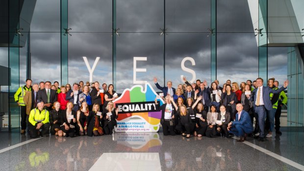 Canberra Airport managing director Stephen Byron with employees in support of marriage equality. 