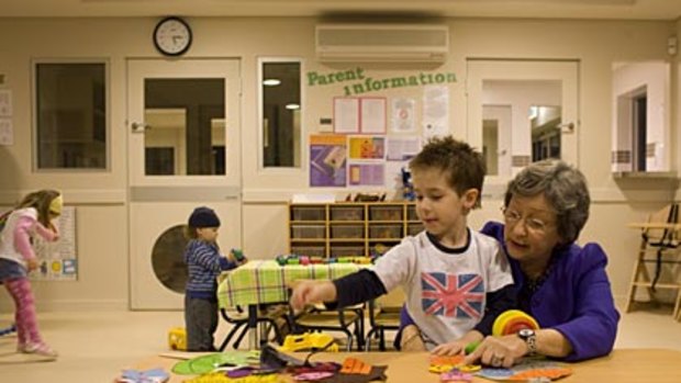 Child's play... Loretta Bennetts with Jett Mansour, 4, at the new day-care centre at the Revesby Workers' Club.