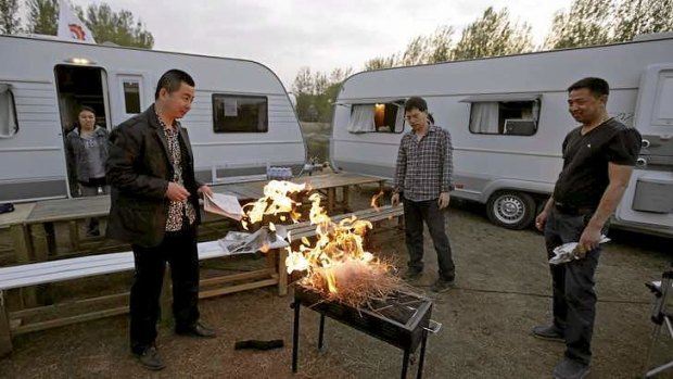 Barbecue enthusiasts at a caravan park on the outskirts of Beijing.