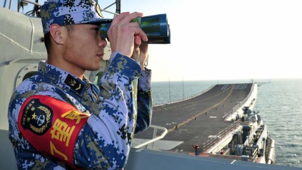 On patrol: China said its first aircraft carrier, the Liaoning,  left Qingdao and passed through the Taiwan Strait on Thursday on a training mission in the South China Sea.