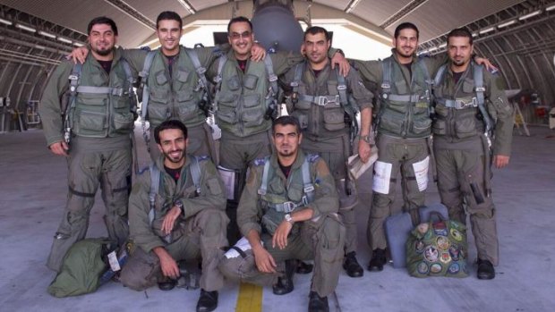 Threatened: Saudi air force pilots after taking part in a mission to strike Islamic State targets in Syria.