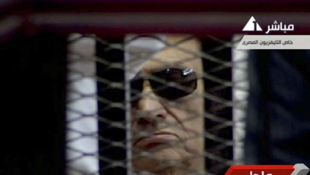 Sentenced ... Hosni Mubarak is seen in the defendant's cage.