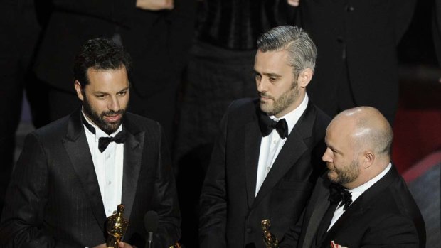 Emile Sherman, left, Iain Canning  and Gareth Unwin  accept the Oscar for best motion picture for The King's Speech.