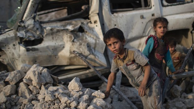 Children amid the rubble of Mosul.