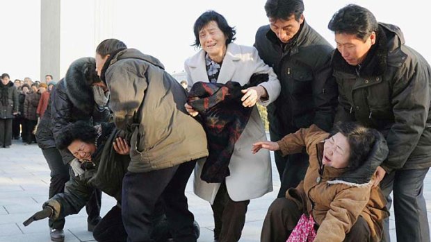 Pyongyang residents react as they mourn the death of North Korean leader Kim Jong-il.
