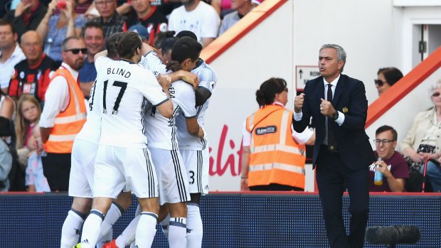 Manchester United's manager Jose Mourinho and his players celebrate scoring against Bournemouth.