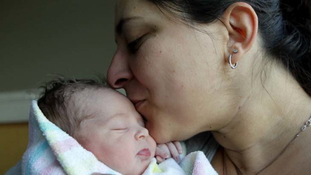 Plus one &#8230; one-day-old Ana Reid - with her mother, Helen Tsamoulos - is part of a dwindling portion of the Australian population aged under 18.