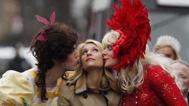 Claire Danes is kissed by members of Hasty Pudding Theatricals.