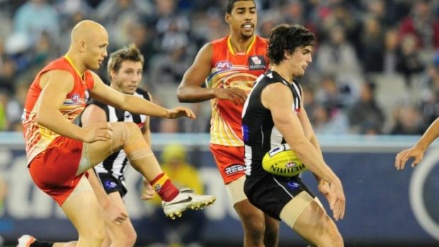 Trading places: Gary Ablett and Scott Pendlebury.