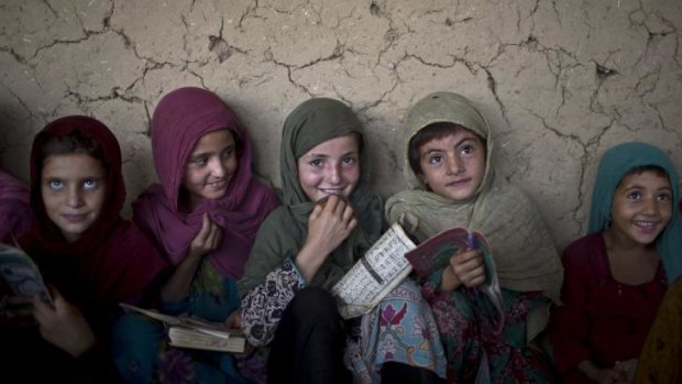 Malala their champion: Afghan refugee girls at school in Islamabad, Pakistan.